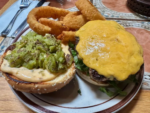 Monroe's Restaurant signature dishes Red or Green Chile Enchiladas, Chile Rellenos, Tamales, Huevos Rancheros, Green Chile Cheeseburger.